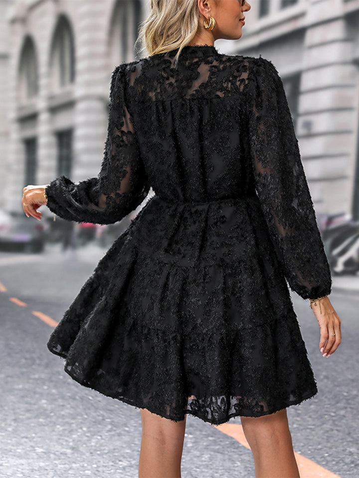 Black textured puff sleeve tiered mini dress with button detail