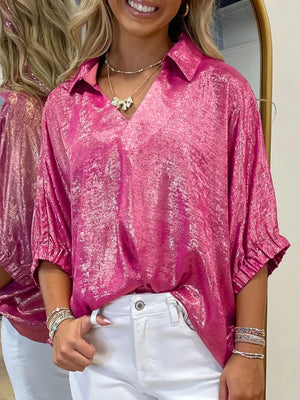 Lustrous collared V-neck metallic shirt in deep rose, 100% polyester, with ruched sleeves.