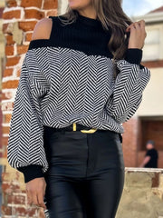 Black chevron knit sweater with cold shoulder cutouts and a black turtleneck.