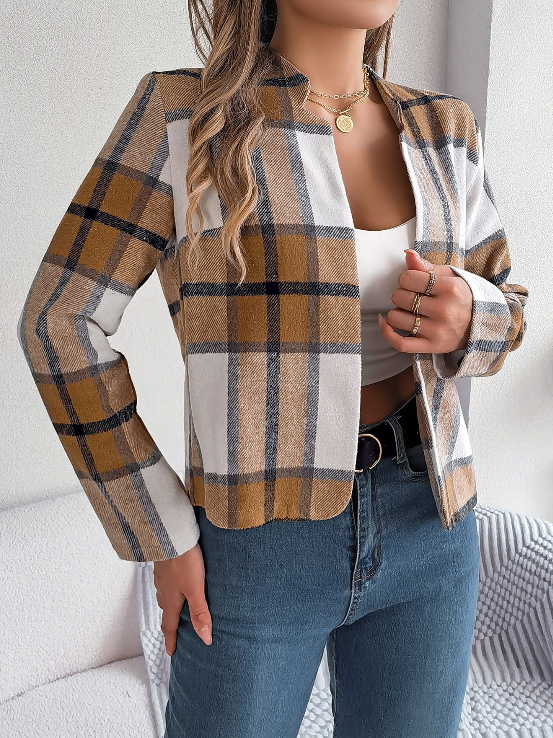 Collarless plaid cropped jacket in camel, white, and black, with a relaxed fit.