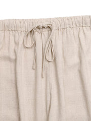 Relaxed drawstring wide-leg trousers in natural linen with a tie waist.