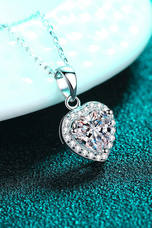 Silver heart cut halo pendant necklace with clear cubic zirconia on a sterling silver chain.