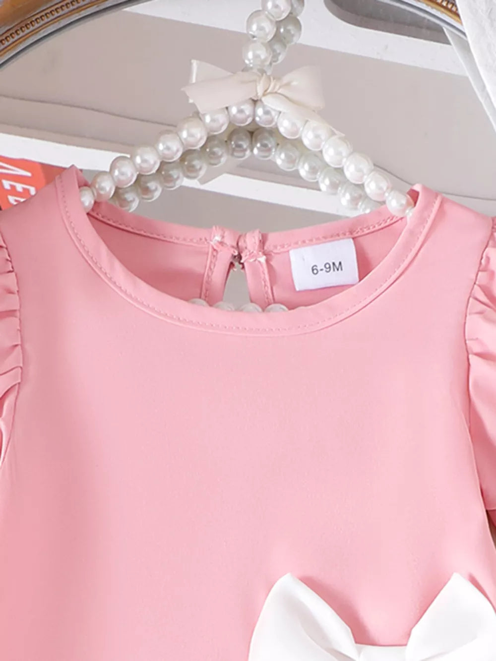 Children's Bow Puff Sleeve Dress in Pink, side view