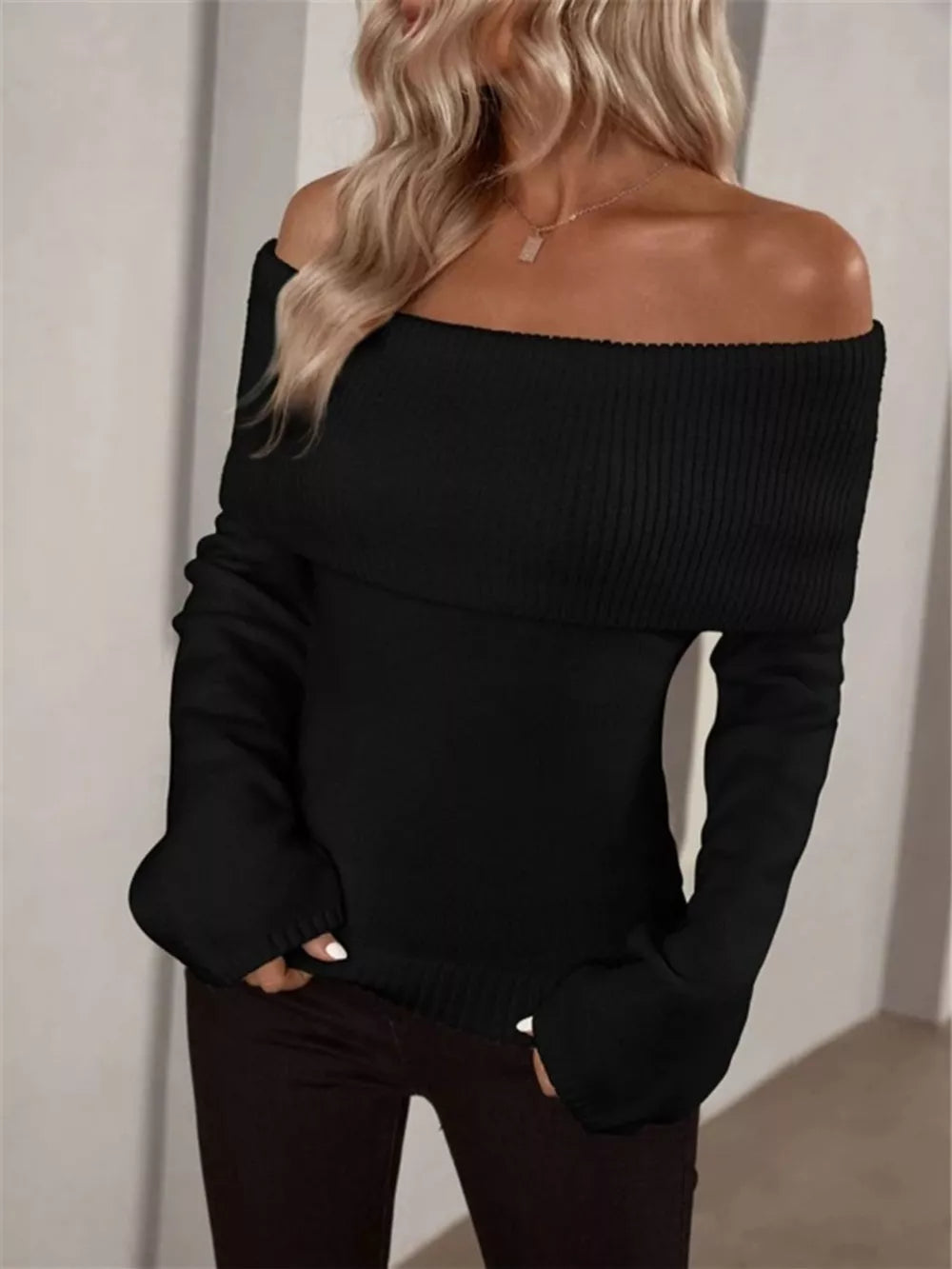 Black off-shoulder ribbed knit sweater with long sleeves
