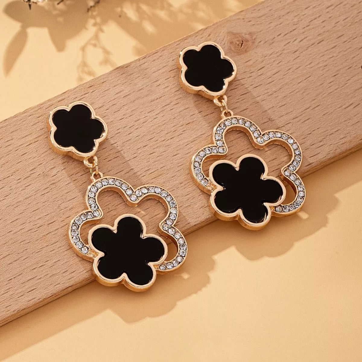Black clover dangle earrings with 18K gold plating and crystal accents