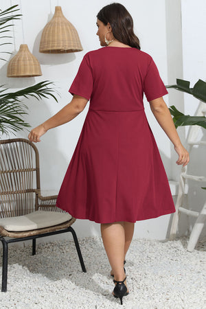 Deep Red midi dress with short sleeves and flared skirt.
