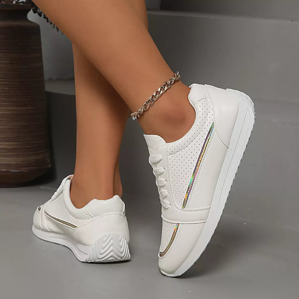 White lace-up sneakers with perforated detail and iridescent stripe accents.