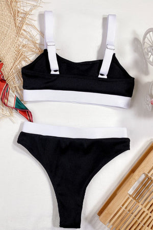 Ribbed black high-waist bikini set with white trim and adjustable straps.