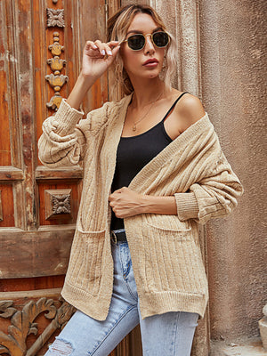 Tan textured open-front cardigan with pockets and ribbed cuffs.