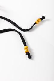 Black blouse drawstring with wooden beads and tassel detail
