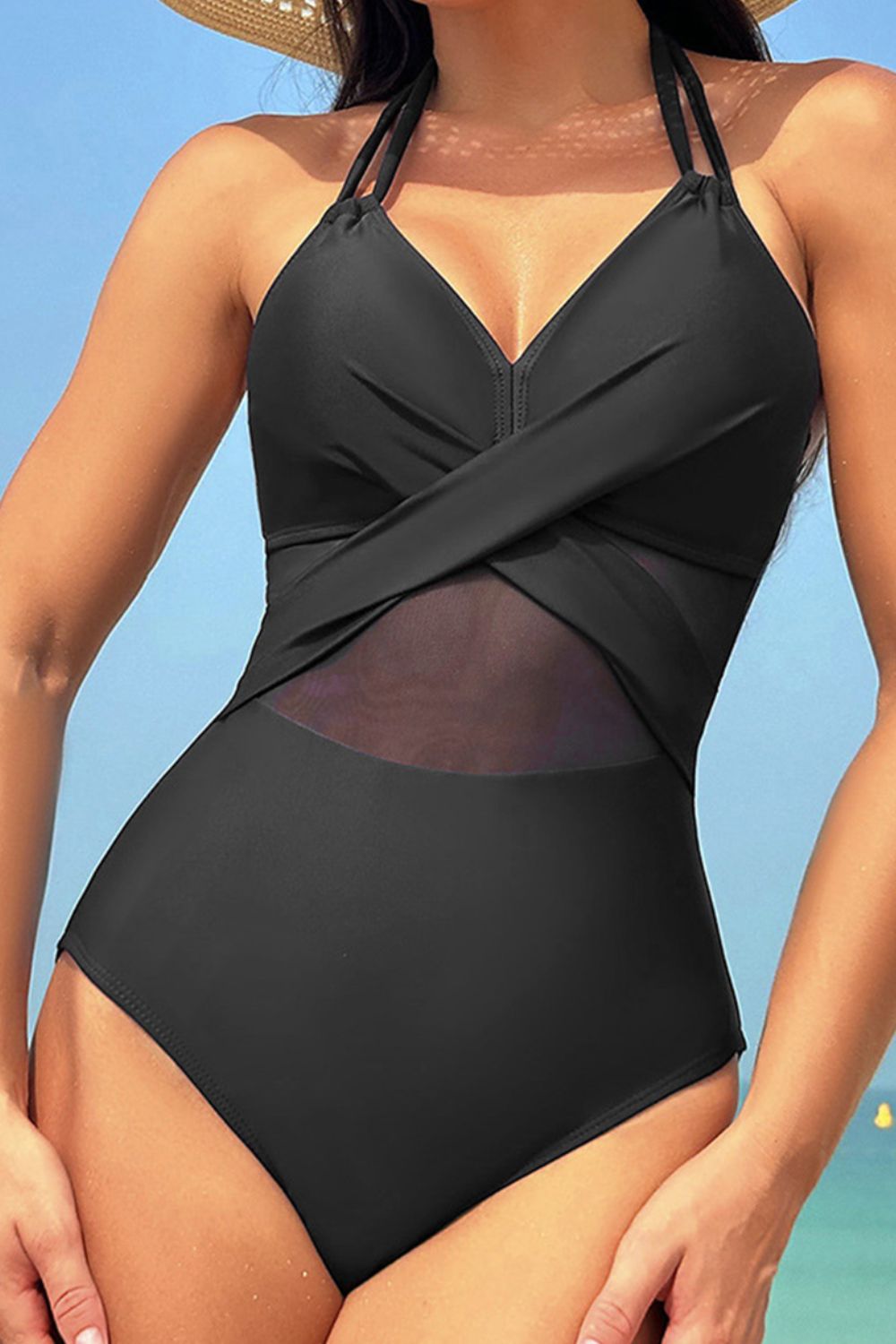 Black crossover halter swimsuit with mesh inset detail
