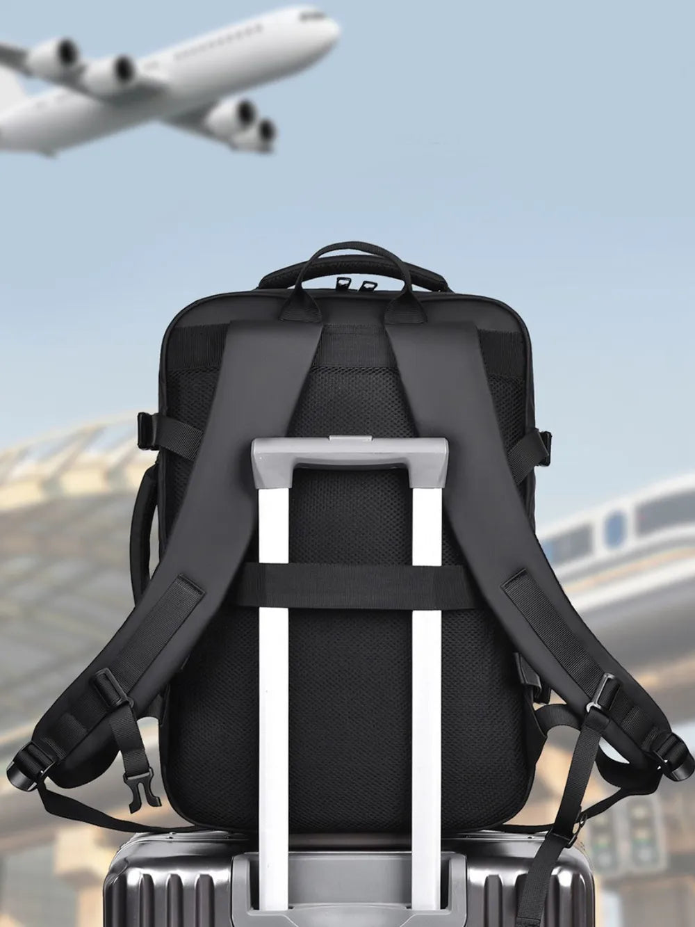 Black convertible commuter backpack with trolley strap and padded straps.