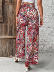 Paisley palazzo trousers in multicolor with a drawstring waist and wide leg.