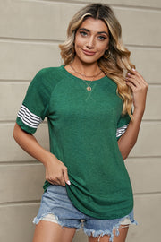 Dark green raglan sleeve tee with white varsity stripes on sleeves