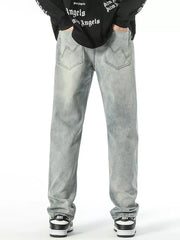 Classic loose fit vintage light wash denim jeans with wavy pocket stitching.