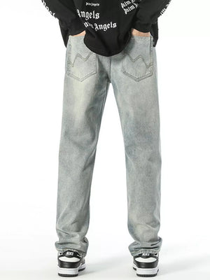 Classic loose fit vintage light wash denim jeans with wavy pocket stitching.