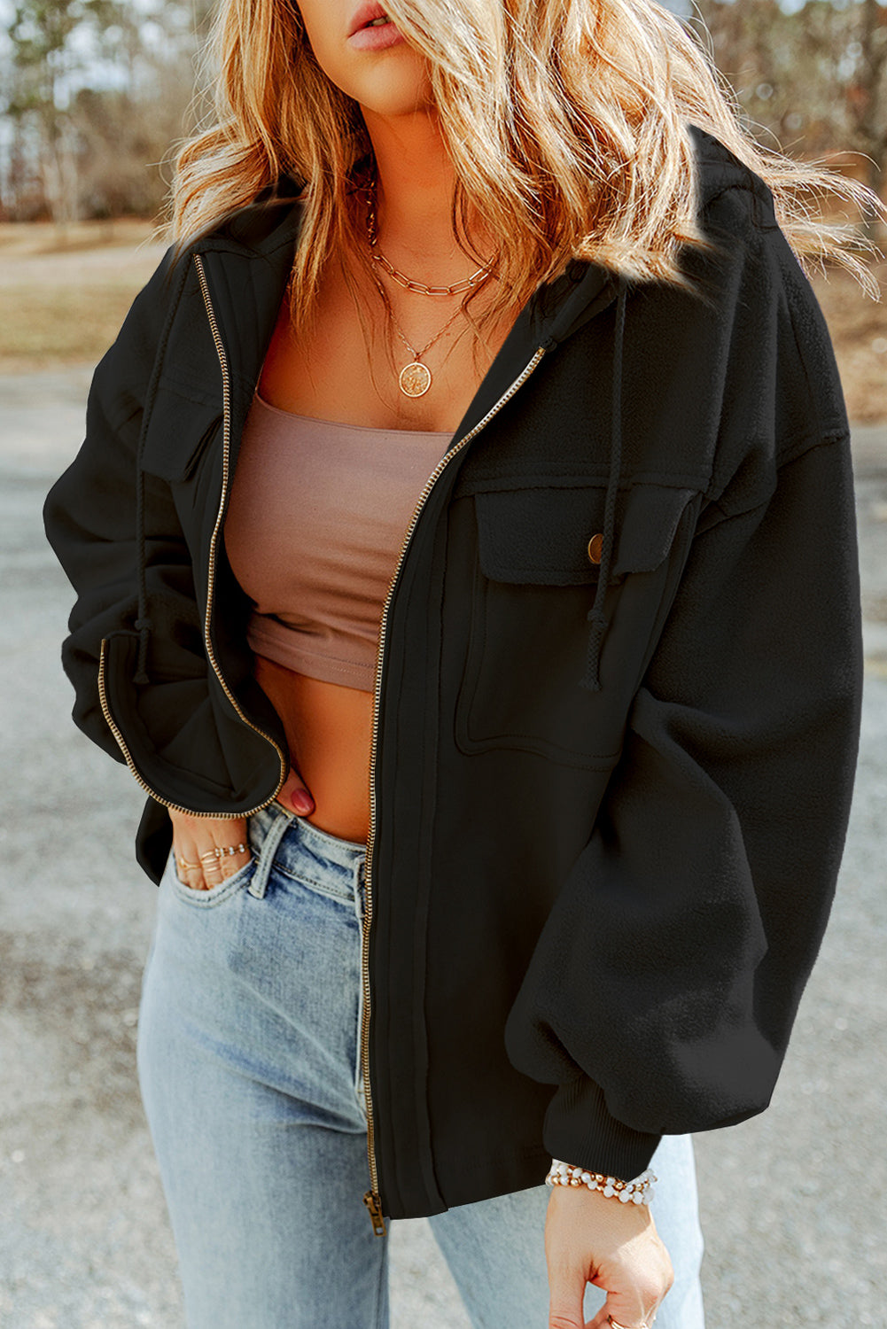 Black textured utility hoodie jacket with zip front, chest pockets and drawstring hood.