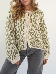 Sage leopard print tie-front cropped cardigan with cream trim and ties.