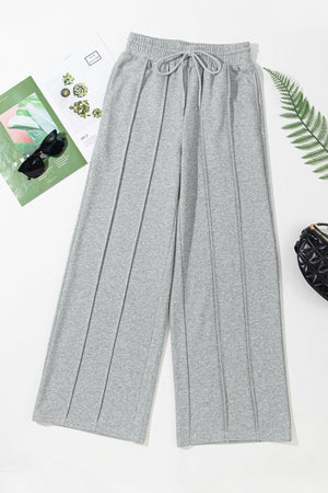 Gray seamed wide leg lounge trousers with drawstring waist and elastic waistband.