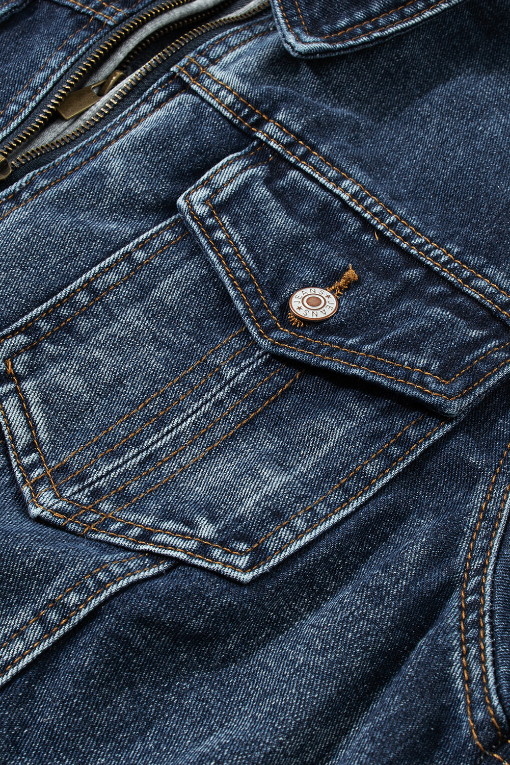 Dark blue denim jacket with zipper and buttoned chest pocket detail