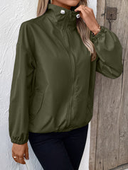 Army green nylon bomber jacket with drawstring hem and zippered front.