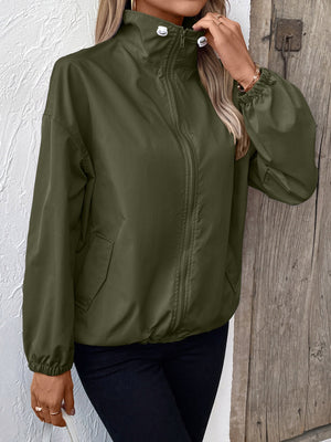 Army green nylon bomber jacket with drawstring hem and zippered front.
