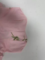 Blush pink tube maxi dress with a delicate green floral print.