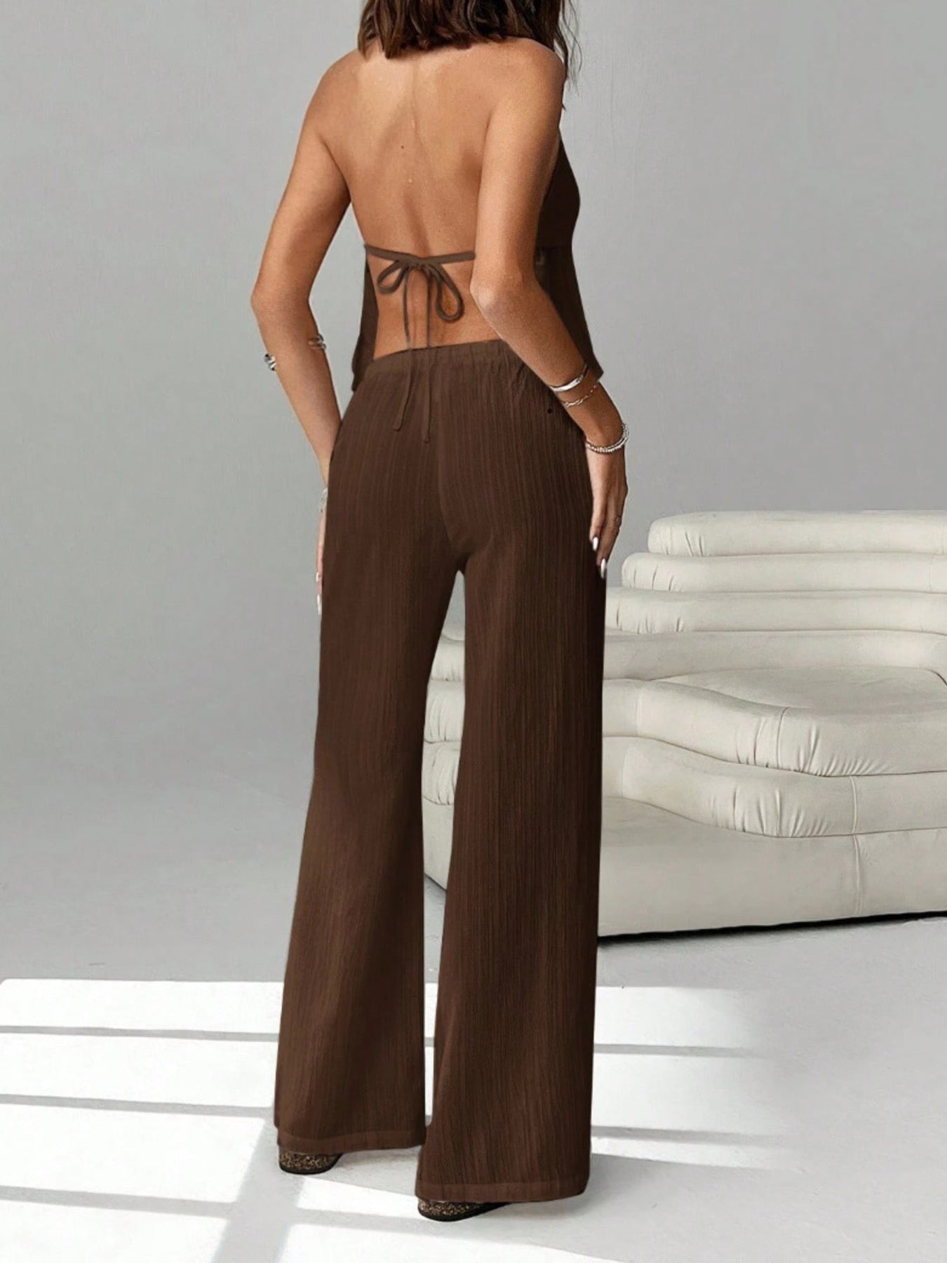 Brown halter neck cami and relaxed fit pants set with drawstring waist.