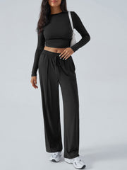 Black ribbed knit crop top and wide leg pants set with drawstring waist.