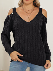 Black cable knit sweater with cold-shoulder detail and pearl buttons, V-neck