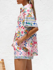 Citrus print resort set with checkered pattern, button-up shirt and shorts.