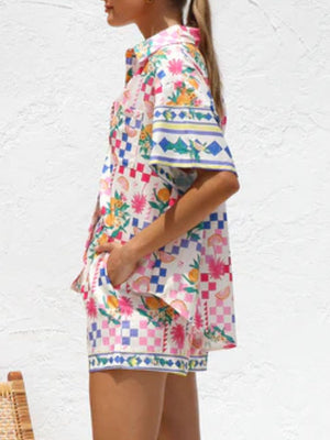 Citrus print resort set with checkered pattern, button-up shirt and shorts.