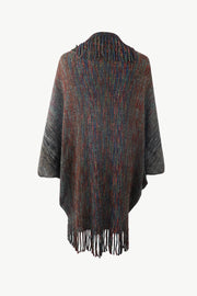 Textured stripe fringe cape in multicolor knit with fringe trim.