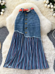 Patchwork denim midi skirt with button front, frayed hem, and pleated striped detail.