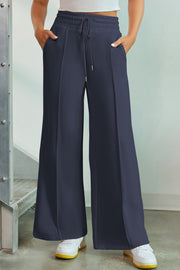 French Blue palazzo joggers with center seam detail and drawstring waist.