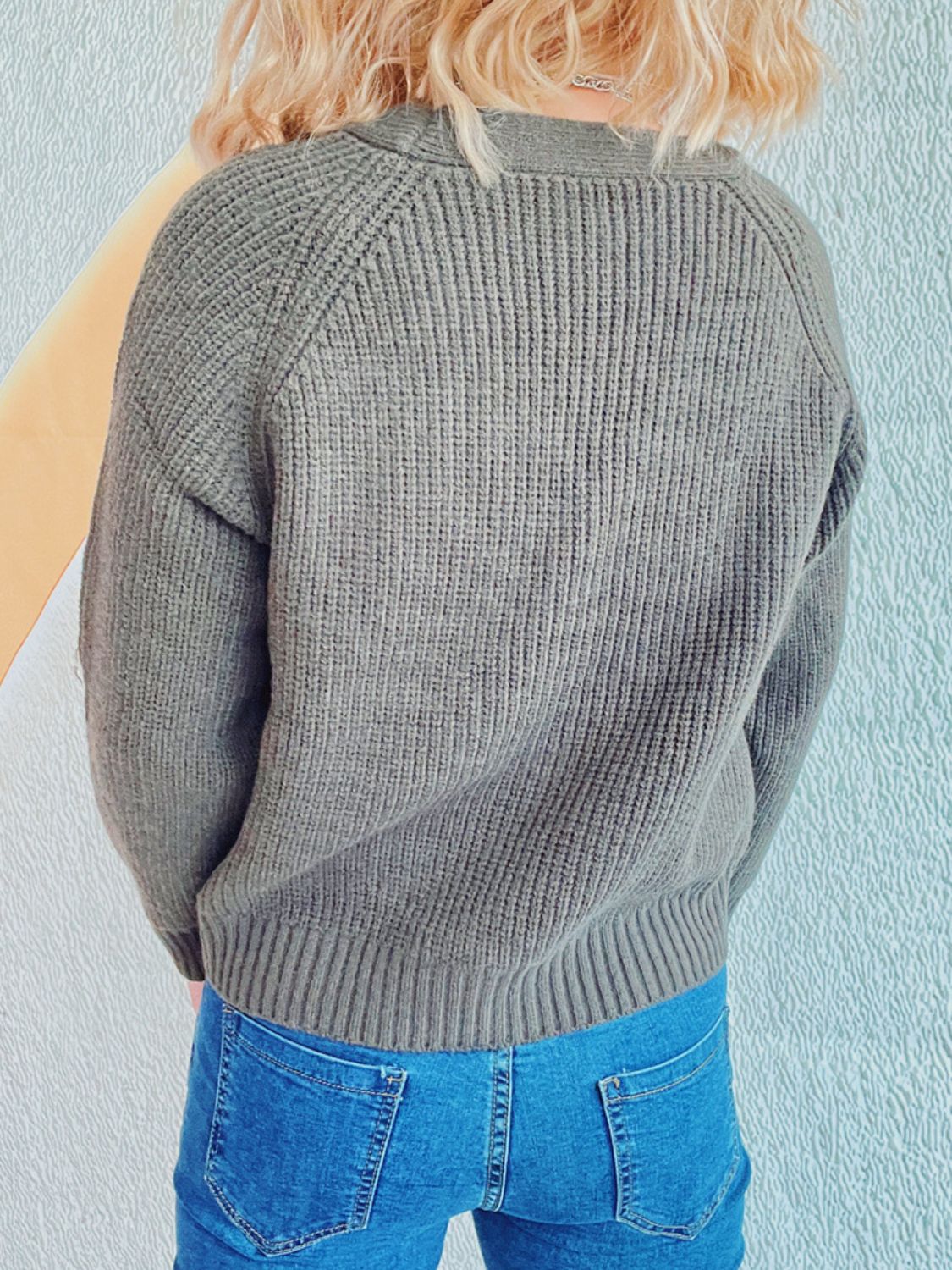 Sage cable knit raglan cardigan with ribbed texture and crew neckline.
