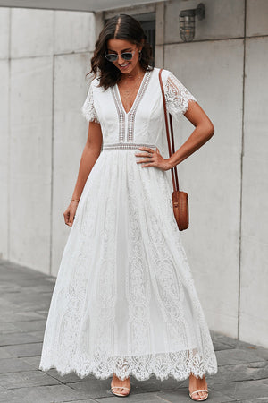 White lace midi dress with V-neck, short sleeves, and scalloped hem.