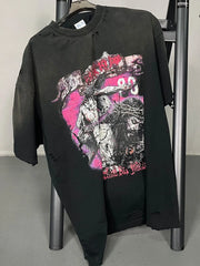 Black oversized ripped graphic tee with distressed details and bold print