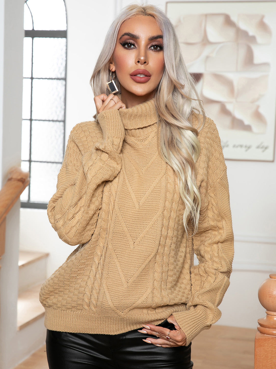 Khaki acrylic cable knit turtleneck sweater with textured pattern.
