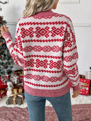 Red and white patterned long-sleeve sweater with a round neck.