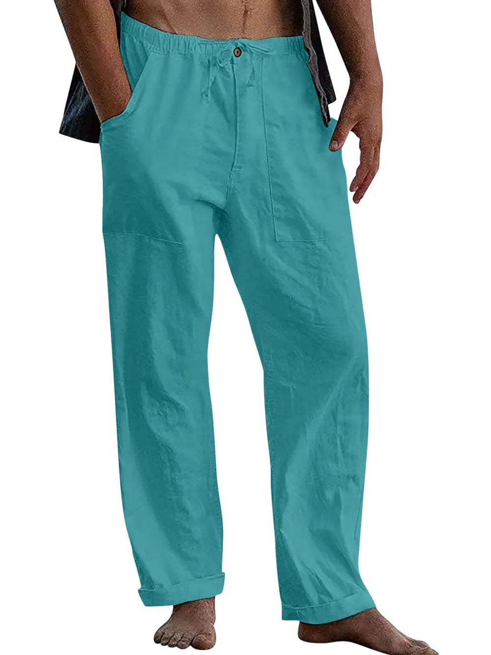 Turquoise linen drawstring trousers with relaxed fit and cuffed hems.