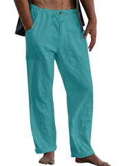 Turquoise linen drawstring trousers with relaxed fit and cuffed hems.