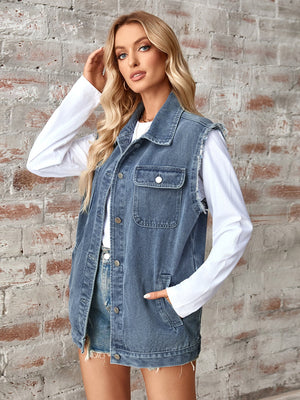 Dusty blue denim utility vest with raw edges, button front, and chest pockets.