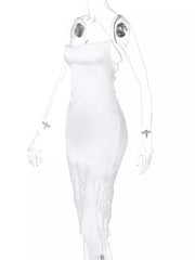 White satin slip dress with lace trim hem and spaghetti straps.