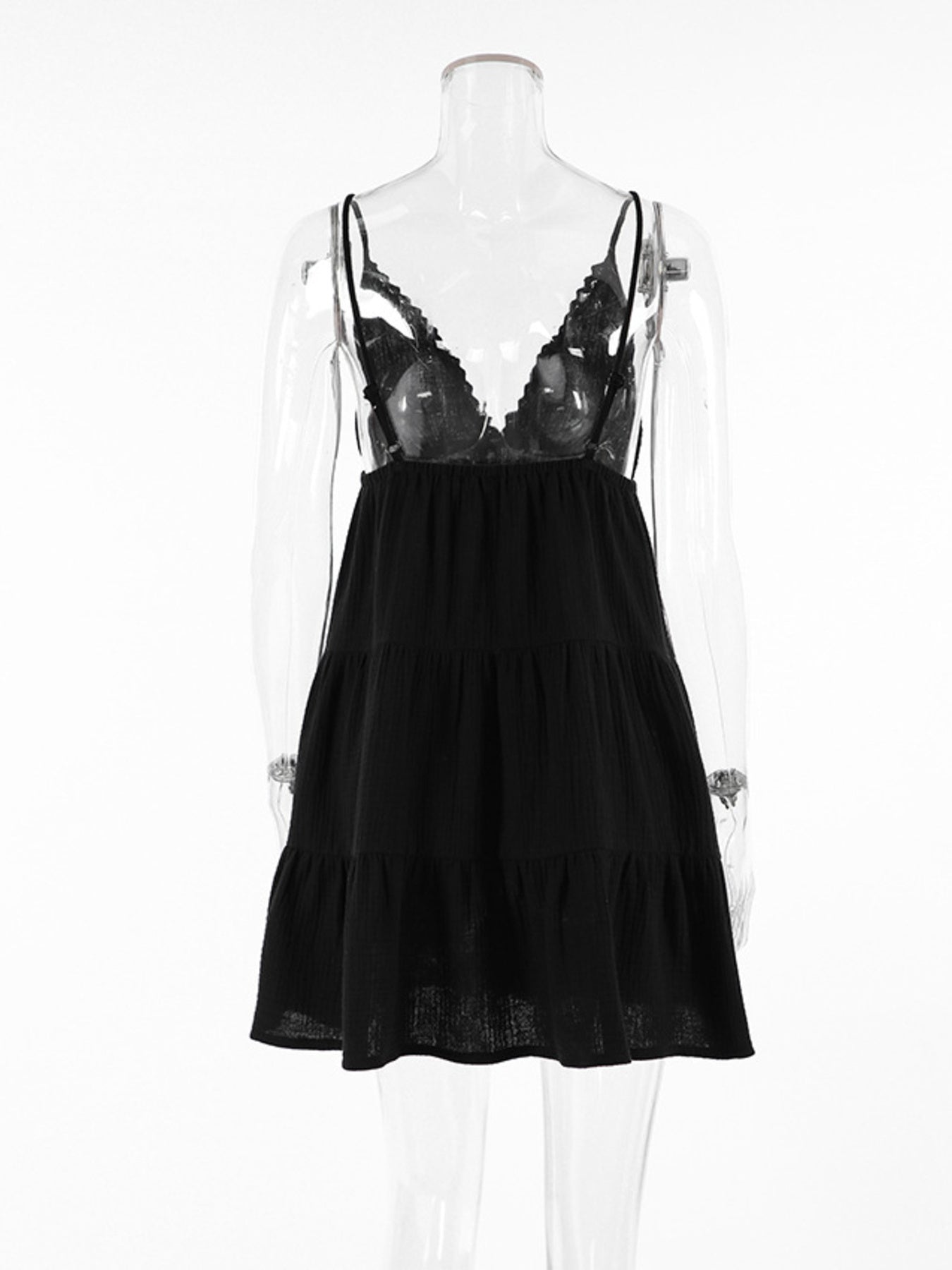 Black cotton tiered mini dress with lace trim and spaghetti straps.