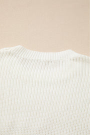 Ivory knit sweater with crew neck and ribbed texture