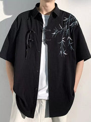 Black relaxed fit men's shirt with bamboo print and toggle closure