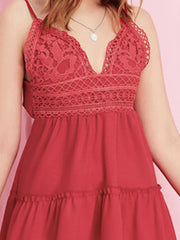 Red lace-trimmed mini cami dress with ruffle hem and V-neck.