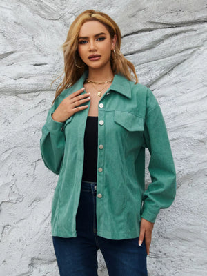 Textured corduroy button-up jacket in Peacock Green with chest pockets and silver buttons.