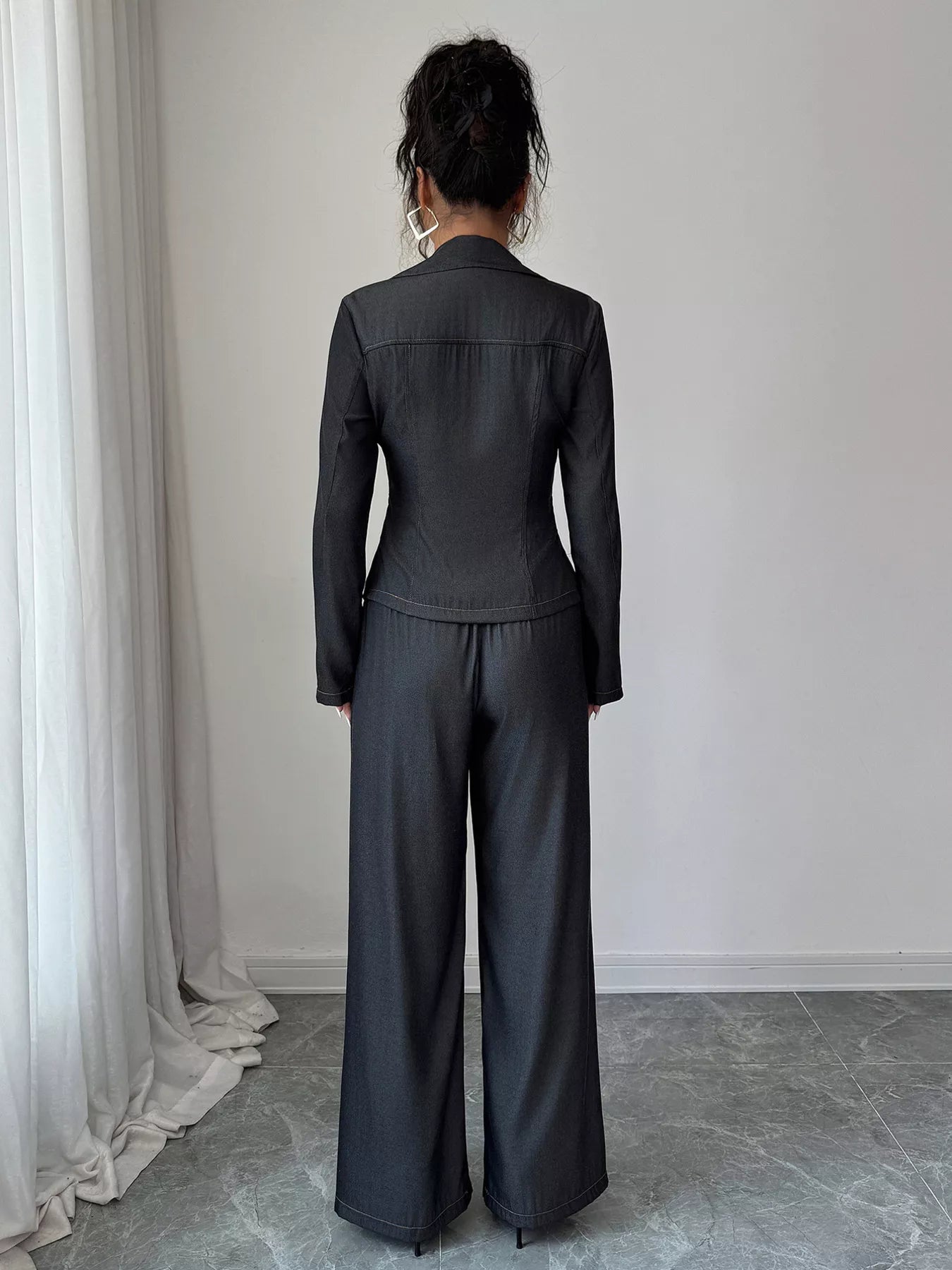 Gray button-up shirt and wide-leg pants set with contrast stitching.
